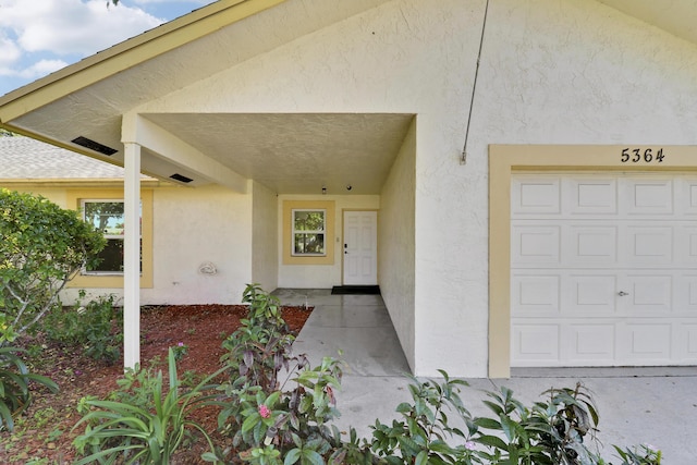 entrance to property featuring a garage