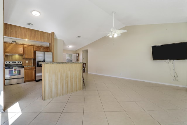 kitchen featuring vaulted ceiling, backsplash, light tile patterned floors, stainless steel appliances, and light stone countertops