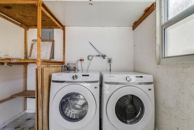 laundry area featuring washing machine and clothes dryer