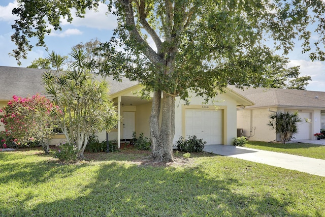 view of front of house with a garage, a front yard, and central air condition unit