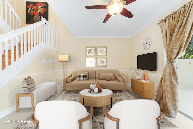 living room featuring crown molding and ceiling fan