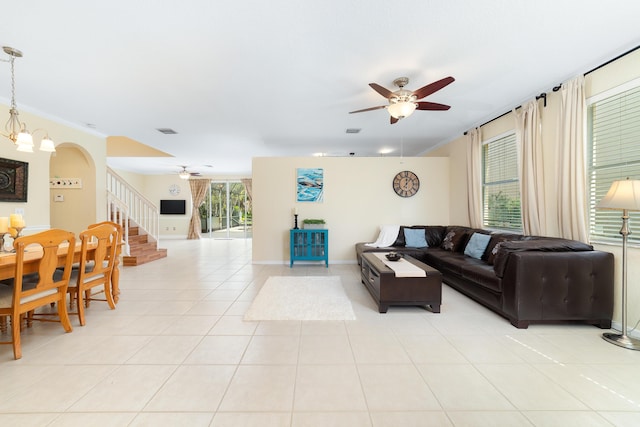 tiled living room with ceiling fan