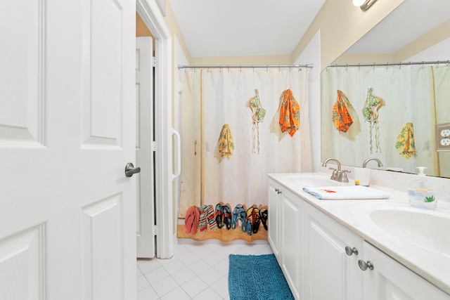 bathroom with vanity and tile patterned flooring