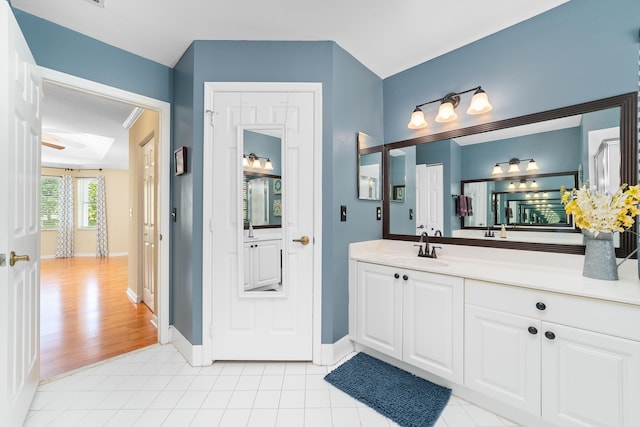 bathroom with tile patterned flooring and vanity