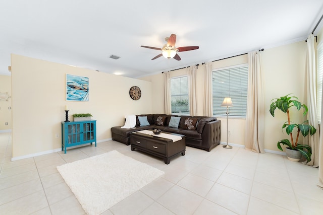 tiled living room featuring ceiling fan