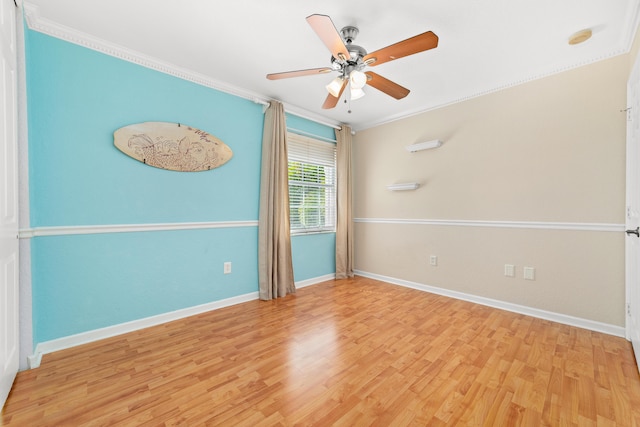 spare room with light hardwood / wood-style flooring, ornamental molding, and ceiling fan