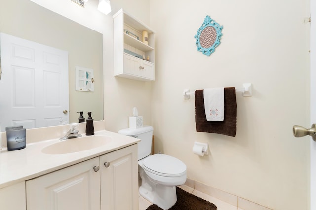 bathroom featuring tile patterned floors, vanity, and toilet