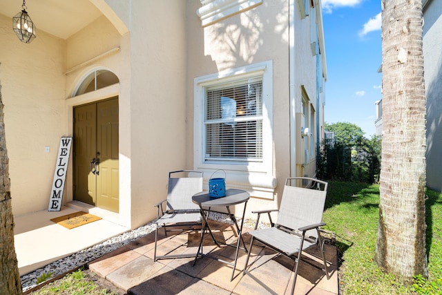 entrance to property featuring a patio