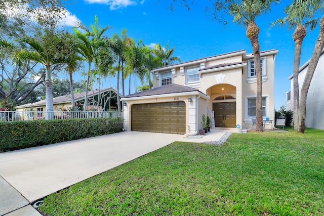 view of front of house with a garage and a front lawn