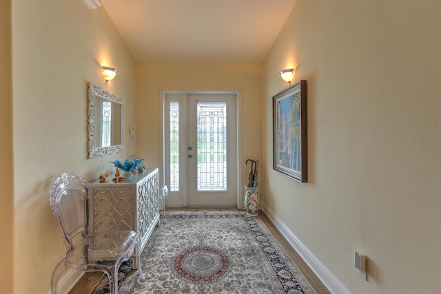 foyer with wood-type flooring