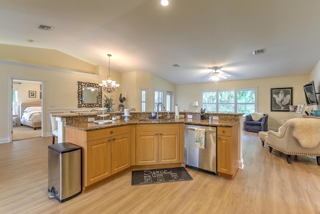 kitchen with sink, a center island with sink, hanging light fixtures, stainless steel dishwasher, and stone counters