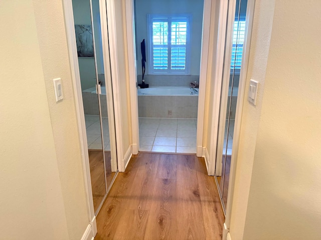 hallway with light wood-type flooring