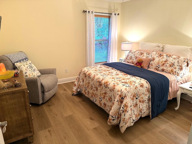 bedroom with wood-type flooring