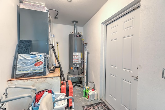 utility room with gas water heater