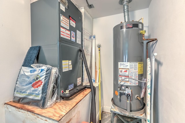 utility room featuring water heater