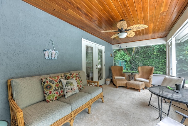 sunroom with ceiling fan, wood ceiling, and french doors