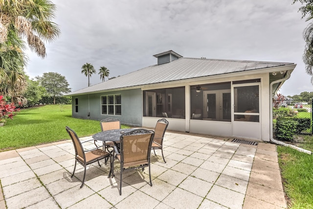 view of patio / terrace with a sunroom and french doors