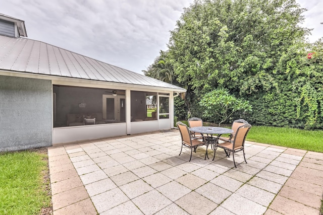 view of patio featuring a sunroom