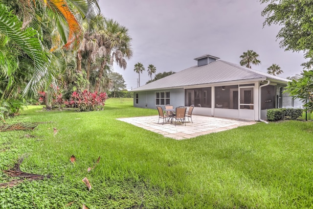 exterior space featuring a sunroom and a patio area