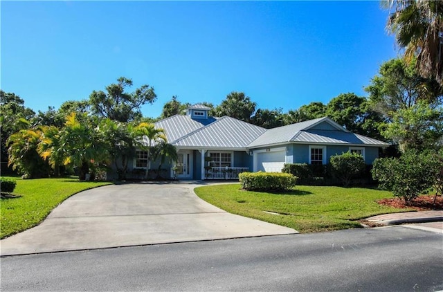 ranch-style home with a garage and a front yard