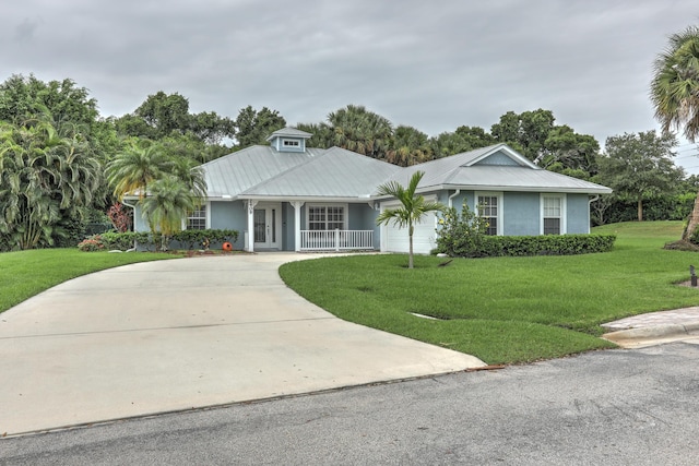 ranch-style house with a garage and a front yard