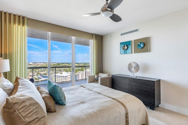 bedroom featuring a ceiling fan, visible vents, light carpet, and baseboards