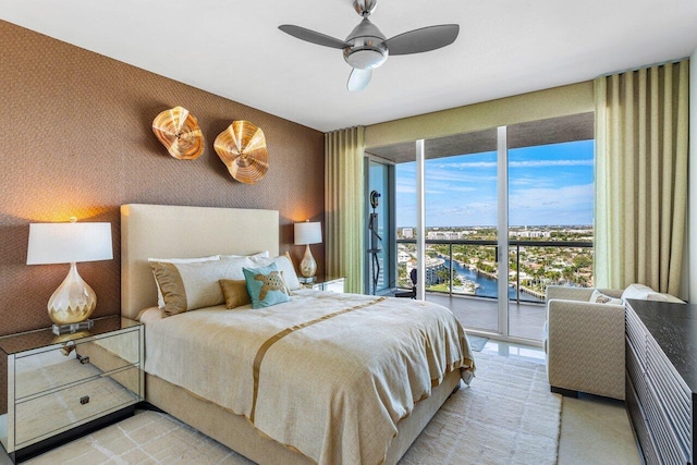 bedroom with wallpapered walls, access to outside, and ceiling fan