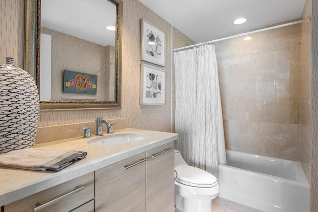 bathroom featuring toilet, shower / tub combo, vanity, and wallpapered walls