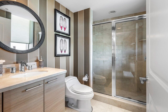 bathroom featuring toilet, marble finish floor, a shower stall, and vanity