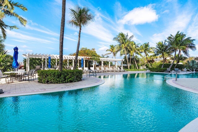 community pool featuring a pergola