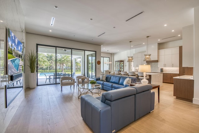 living room with light hardwood / wood-style flooring