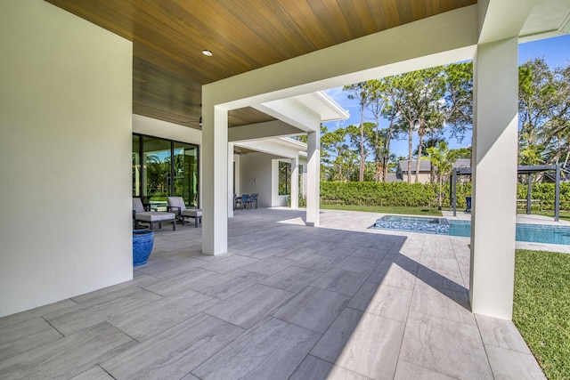 view of patio with a fenced in pool