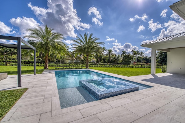 view of pool with an in ground hot tub, a yard, and a patio area