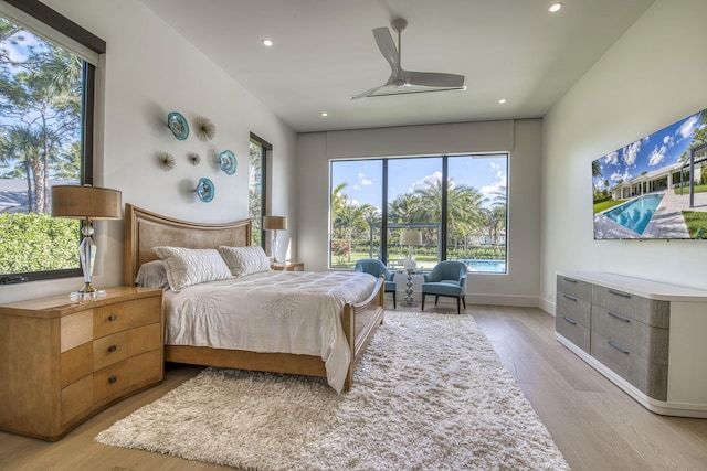 bedroom featuring ceiling fan and light hardwood / wood-style floors