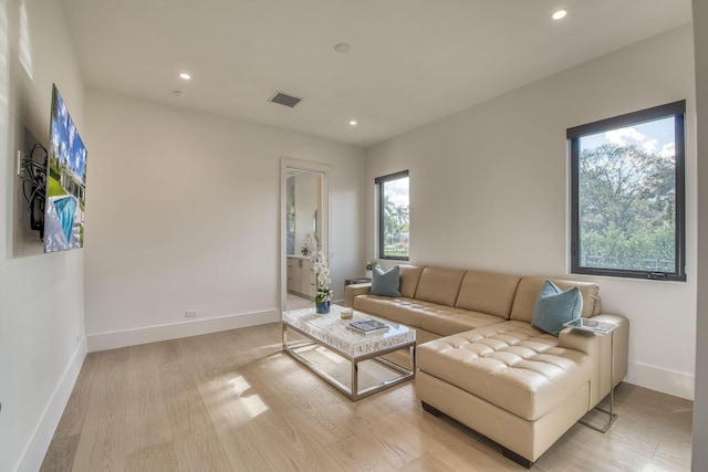 living room with light hardwood / wood-style floors