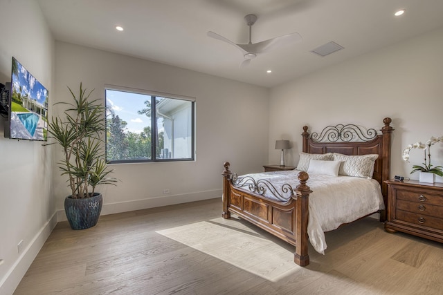 bedroom with ceiling fan and light wood-type flooring