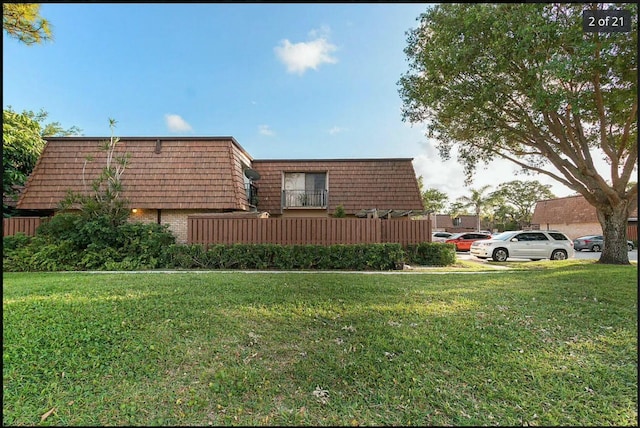 view of property exterior with a yard