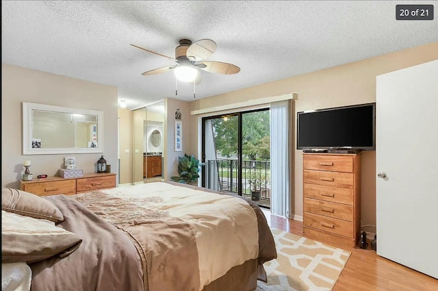 bedroom featuring ceiling fan, access to exterior, light hardwood / wood-style flooring, and a textured ceiling