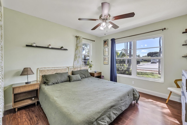 bedroom featuring dark wood-type flooring and ceiling fan