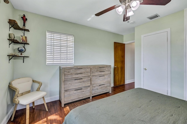 bedroom featuring dark hardwood / wood-style flooring and ceiling fan