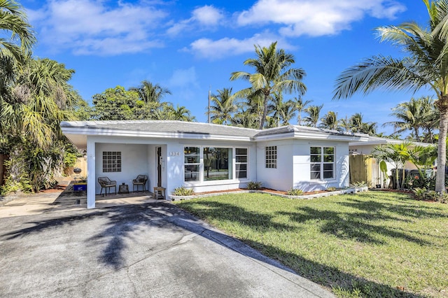 ranch-style home with a front lawn