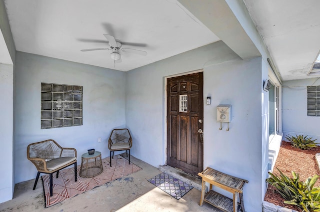 entrance to property with ceiling fan