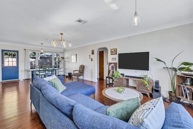 living room featuring ornamental molding and dark hardwood / wood-style floors