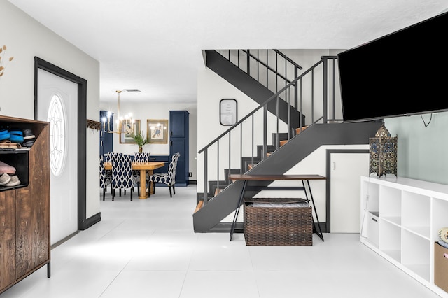 stairs featuring a notable chandelier