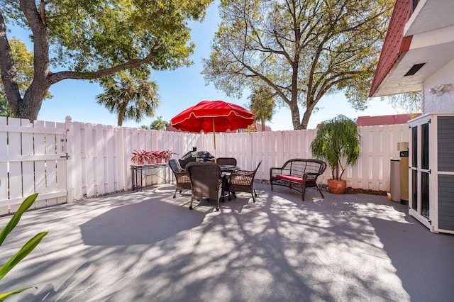 view of patio with a storage shed