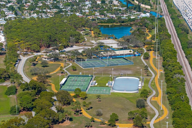 birds eye view of property with a water view