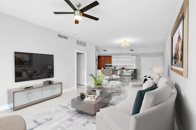 701 N Fort Lauderdale Beach Blvd Unit 504, Fort Lauderdale, FL 33304 - living area featuring a ceiling fan and light marble finish floors