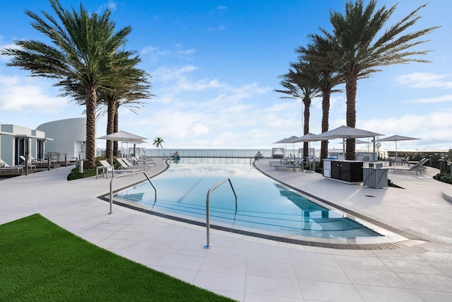 view of swimming pool featuring a patio and a gazebo