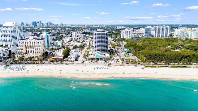 bird's eye view featuring a view of city, a beach view, and a water view