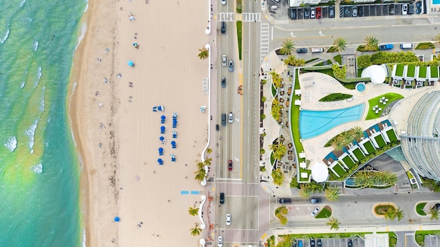 bird's eye view with a view of the beach and a water view